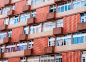 Thumbnail 2 of 6 - the facade of a building with red bricks and windows