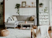Thumbnail 4 of 6 - a living room with a couch and a rug