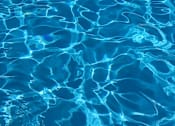 Thumbnail 3 of 5 - A close up view of the rippling water in a pool.