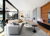 Thumbnail 5 of 6 - a living room with a couch and a coffee table