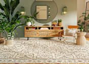 Thumbnail 4 of 6 - a living room with a couch and a mirror on the wall