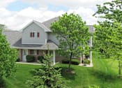 Thumbnail 11 of 12 - A house with a grey roof and a white door is surrounded by green trees.