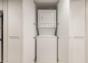 Thumbnail 36 of 47 - A white dishwasher is in the middle of a kitchen.