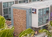 Thumbnail 46 of 47 - A building with a sign that says "LOFT 2015" on it.