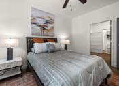 Thumbnail 5 of 18 - a bedroom with a bed and a ceiling fan