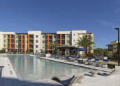 Thumbnail 25 of 29 - Poolside Sundeck With Relaxing Chairs at Integra Sunrise Parc, Florida