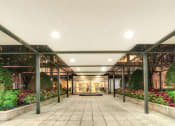 Thumbnail 38 of 40 - the lobby of a building with plants on both sides of it