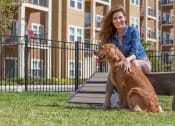 Thumbnail 30 of 34 - Woman with Dog at Dog Park