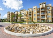 Thumbnail 11 of 34 - The Gate Apartments Entrance with Water Feature