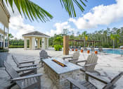 Thumbnail 28 of 34 - The Gate Apartments Fire Pit overlooking Pool area