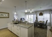Thumbnail 3 of 34 - The Gate Apartments Model Unit Kitchen