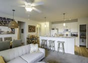 Thumbnail 4 of 34 - The Gate Apartments Model Unit Living Room and Kitchen Area