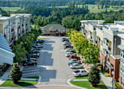 Thumbnail 33 of 33 - A parking lot with cars parked in it.