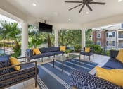 Thumbnail 17 of 26 - exterior resident lounge with seating and tv