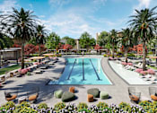 Thumbnail 1 of 7 - A large outdoor swimming pool surrounded by palm trees and lounge chairs.at Elysium, Phoenix Arizona