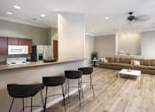 Thumbnail 2 of 39 - A modern living room with a kitchen area at Vintage at Scottsdale, Arizona