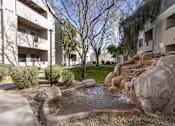 Thumbnail 34 of 39 - A small waterfall in a courtyard surrounded by rocks.at Vintage at Scottsdale, SCOTTSDALE, AZ
