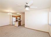 Thumbnail 10 of 22 - A room with a ceiling fan and a desk with a computer.