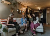 Thumbnail 6 of 26 - three women sitting on a couch in a living room