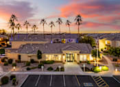 Thumbnail 1 of 30 - Main leasing office at dusk - Arrowhead Landing Apartments