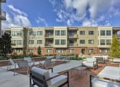 Thumbnail 1 of 12 - Lansdale Station Apartments outdoor fire pit and seating area