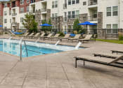 Thumbnail 36 of 36 - our apartments have a resort style pool with lounge chairs