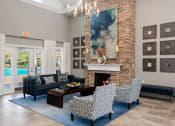 Thumbnail 2 of 21 - Carrington Place at Shoal Creek - Resident clubhouse social area with fireplace