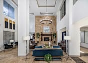 Thumbnail 2 of 37 - Resident clubhouse great room with fireplace - Monterra Las Colinas Apartments