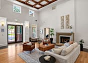 Thumbnail 3 of 28 - Clubhouse great room with fireplace - Belle Harbour Apartments
