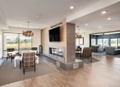 Thumbnail 3 of 46 - Element 25 clubhouse with fireplace and TVs