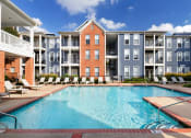 Thumbnail 3 of 24 - Island Park and Harbor Town Square Apartments - Poolside sundeck