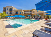 Thumbnail 4 of 23 - Resort-style swimming pool with tanning ledge - ABQ Uptown Apartments