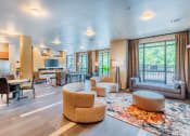 Thumbnail 4 of 26 - Centre Pointe Apartments clubhouse with a clubhouse kitchen and lounge area