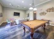 Thumbnail 4 of 24 - Courtney Station Apartments - Resident clubhouse with billiards table