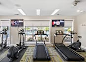 Thumbnail 4 of 29 - 24-hour fitness center with cardio equipment - Evergreen Lenox Park