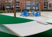 Thumbnail 4 of 24 - Island Park and Harbor Town Square Apartments - Fire pit lounge