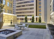 Thumbnail 4 of 36 - a courtyard with tables and chairs and a fountain