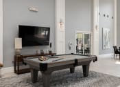 Thumbnail 4 of 18 - Weston Point Apartments - Clubhouse with billiards table