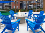 Thumbnail 5 of 24 - Island Park and Harbor Town Square Apartments - Fire pit with seating