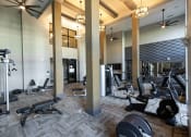 Thumbnail 5 of 19 - The Juncture Apartments fitness center with cardio equipment