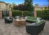 Thumbnail 4 of 30 - Fire pit lounge area - Willow Spring Apartments