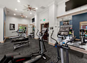 Thumbnail 6 of 28 - Fitness center with weight and cardio machines - Belle Harbour Apartments