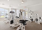 Thumbnail 6 of 22 - State-of-the-art fitness center with weight machines - Courtney Station Apartments