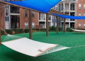 Thumbnail 6 of 24 - Island Park and Harbor Town Square Apartments - Hammock garden
