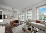 Thumbnail 7 of 36 - a living room with a couch and a coffee table