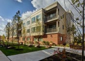 Thumbnail 6 of 12 - Lansdale Station Apartments building exterior showing balconies
