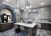 Thumbnail 6 of 23 - The Retreat at Cinco Ranch demonstration kitchen and coffee bar