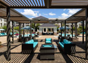 Thumbnail 7 of 19 - The Juncture Apartments outdoor cabana and fire pit lounge