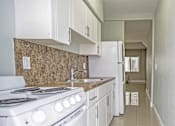 Thumbnail 8 of 14 - White cabinetry in select units - Helios Apartments Miami Beach