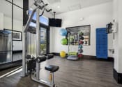 Thumbnail 8 of 22 - Fitness room with weights and cardio equipment - The Acadia at Cornerstar Apartments